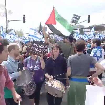 To wave a Palestinian flag at a protest for democracy