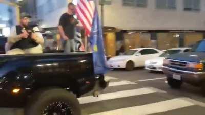 Video showing BLM protestors throwing things and burning Trump flags, then Pro Trump Supporters shooting paintballs and mace into the protestors in Portland