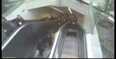 Escalator swallows a dude