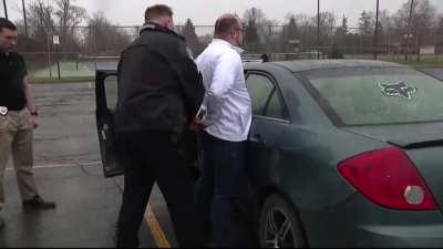 Assaulting a reporter in front of a police station