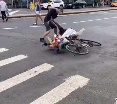 Racist gets knocked off his bike