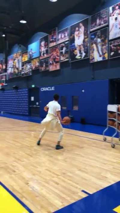 Steph Curry casually draining full court shots after practice.