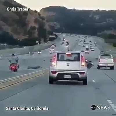 DBS fighting with a motorbike on the highway