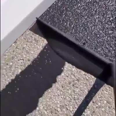 Spreading asphalt on the ground