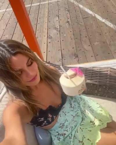 Enjoying a coconut drink