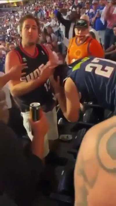 Suns fan whoops dudes ass in Denver and yells suns in 4! This was game 3 (last night) This guy deserves free suns tix for life 😂