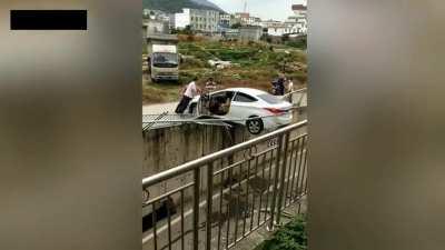 Woman Nearly Reverses Her Car Over The Edge