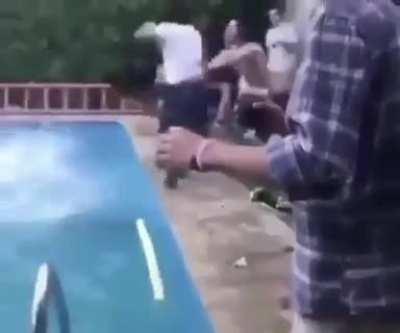 Trying to push him in the pool