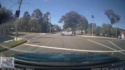 Car running red light gets t boned and flips over