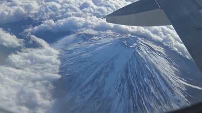 Aerial view of Mount Fuji looks like gliding above an alien world,