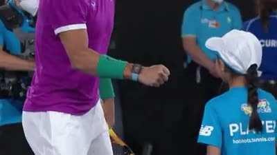 Fist bump from Rafa. Definitely made her day