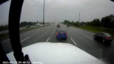 Semi gets brake checked in heavy rain, crashes as a result