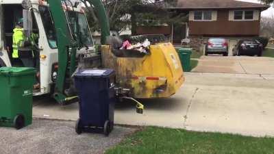 Garbage truck bursts into flames
