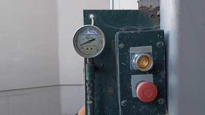 Bitcoin button on the cardboard recycling dumpster at work