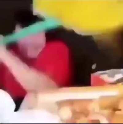 fat guy gets angry while eating meal