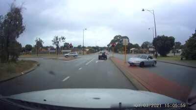 Idiot in sports car on wet road