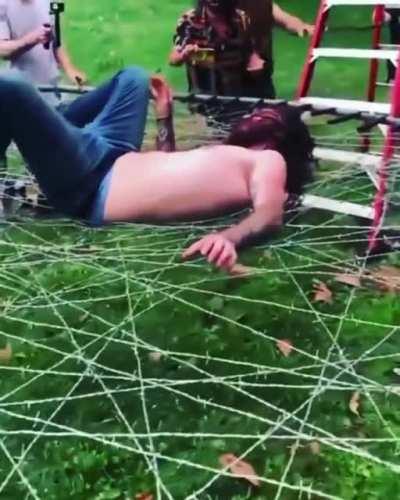 landing on a barbed wire trampoline