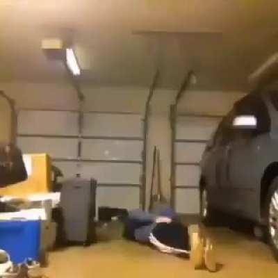 Performing football tricks in the garage