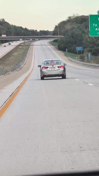 What is this cop doing? East 75 near airport..