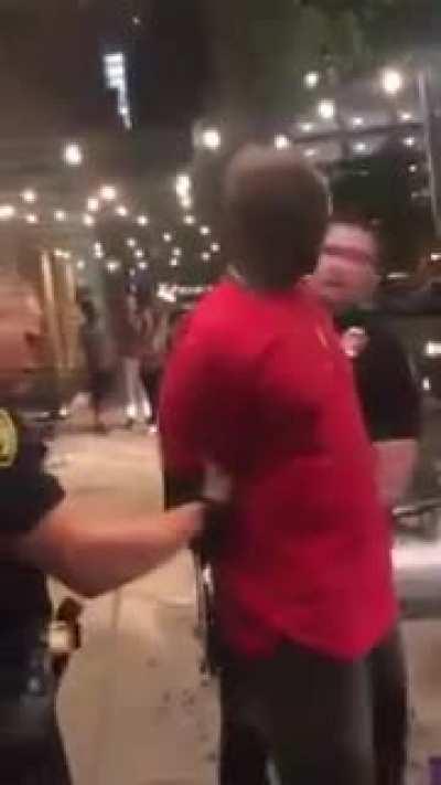 Officers arrest a black man who calls them idiots for arresting the wrong man. When they check his pockets they realize he's an FBI agent.