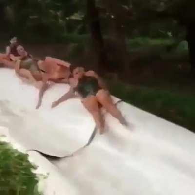 WCGR going down a slide with multiple people