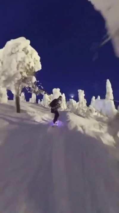 Snowboarding at night in Finland