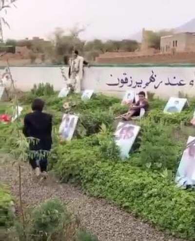 Yemeni child is kissing the photos of his siblings taken from him in this unjustifiable and immoral war.