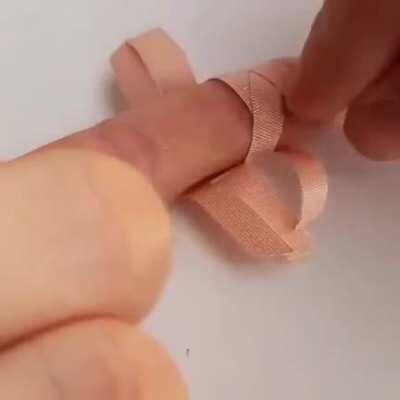 How to apply a bandaid to a finger joint