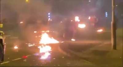 Throwing petrol bombs at police vehicles