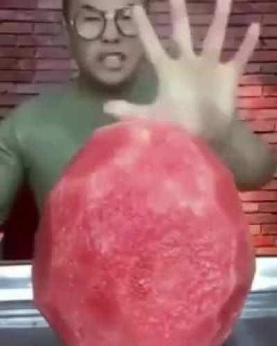 Guy eats (destroys) a watermelon (kinda not really)