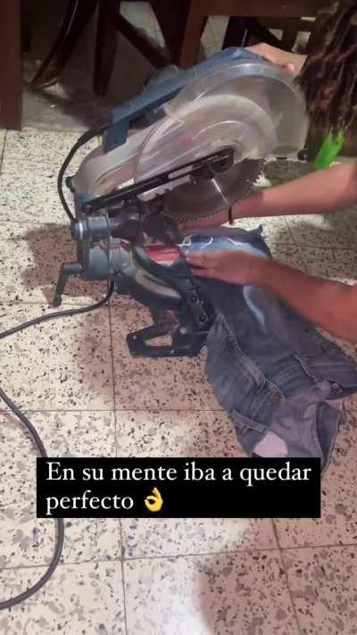 Using a saw to cut jeans 