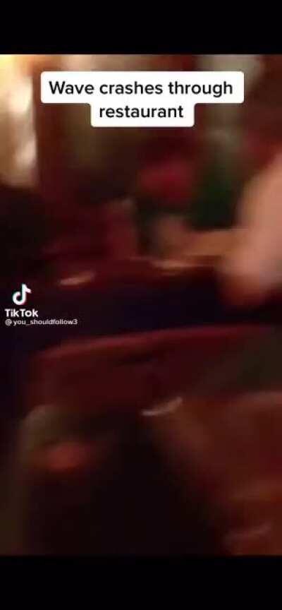 Wave destroys restaurant
