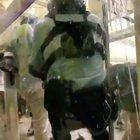 Police officer takes down woman without any protective gear, gets rushed and cornered by other protestors in response.