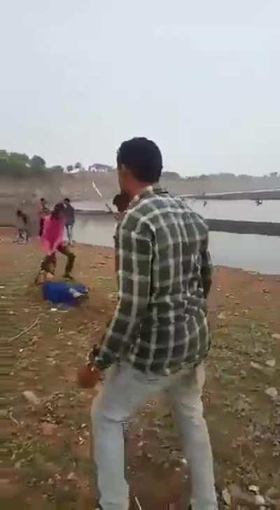 Woman in Dhar, Madhya Pradesh state in India beaten by family members for talking to a man on mobile phone