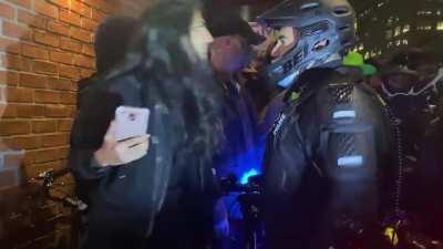 Woman spits on NYPD officer and gets arrested.