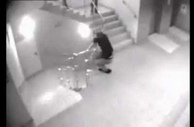 Hanging over the side of a stairway railing and landing on your chest