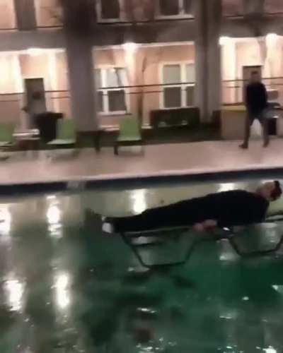 Pushing your friend in a chair across a frozen pool