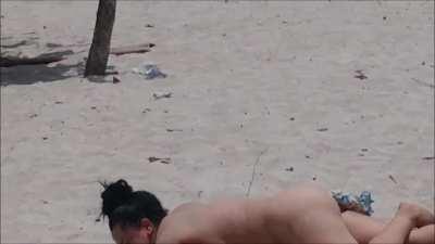 2 Girls strip each other on the beach