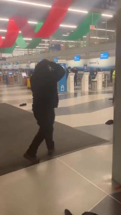 Passengers beat each other with wet floor signs at Chicago O'Hare