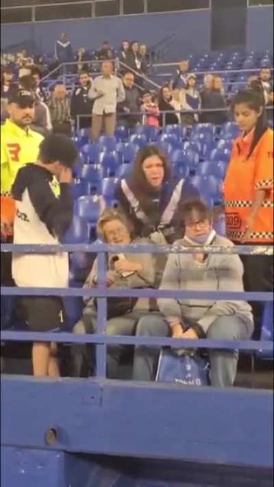 Grown woman steals a football shirt from a boy in Argentina