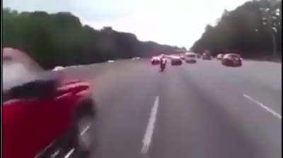 Motercyclists racing between cars goes as well as can