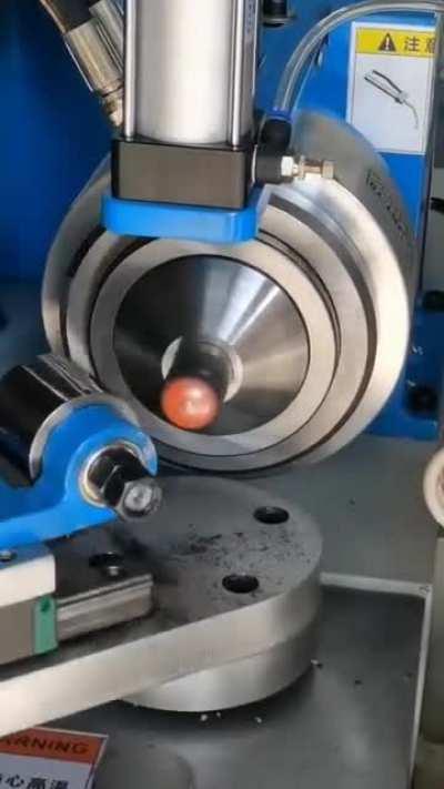 A machine for sealing (and rounding off) pipe ends using heat induction coils.