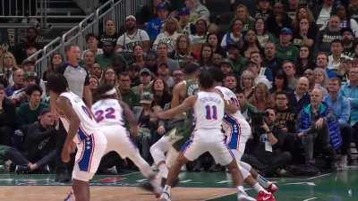 [Highlight] Slow-mo video shows Giannis escape the triple team with a pretty spin move...wait nevermind it's an obvious hooking foul