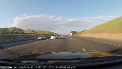 Road raging Camry fake swerves into Hyundai but over-corrects, crashing into barrier
