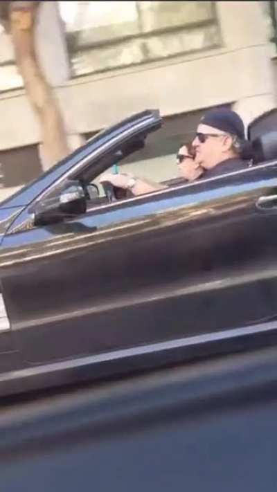 2 idiots huffing nitrous oxide while driving down a street