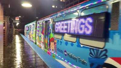 Holiday train running on the Purple line making a stop at Quincy. 12/09/2022