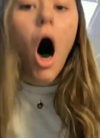 Trying to swallow a long piece of gummy candy