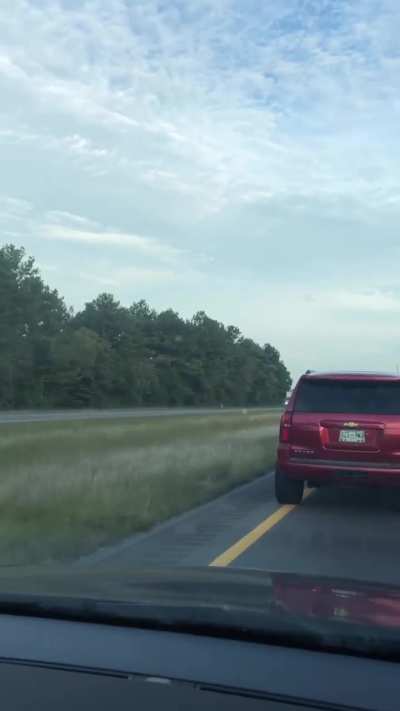 Road Rage at interstate speeds for boxing-in cars in  the fast lane. Water bottle thrown at 1:20