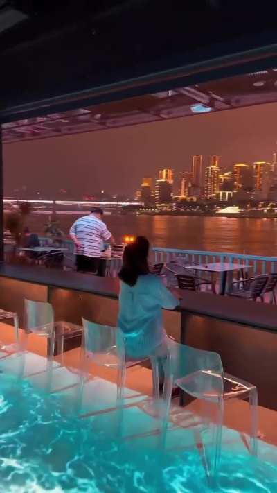 Chongqing skyline across a bar