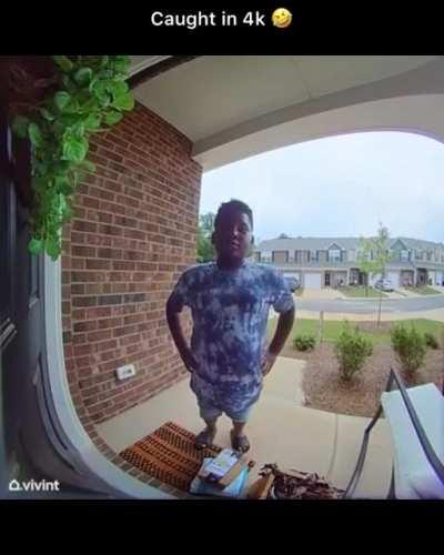 Little kid gets caught trying to steal Amazon packages from someones house